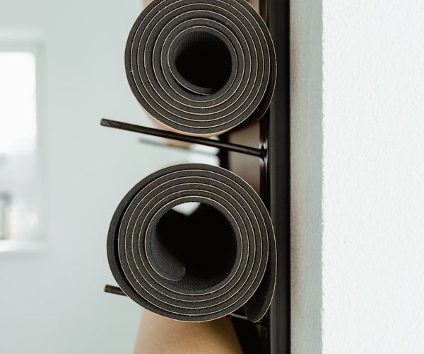 Interior of a calm and welcoming yoga studio with mats ready.